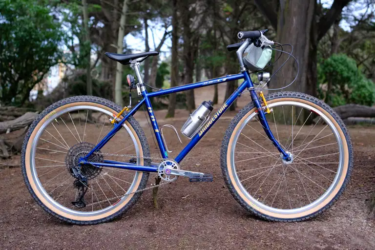 A blue and gold bike with 'Bridgestone' on the downtube and 'BB-1' on the seat and toptube.