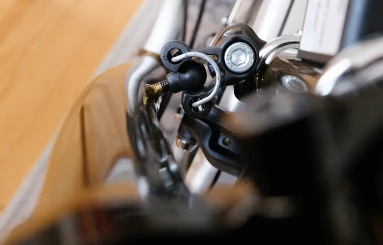 A close-up of the handlebar catch nipple seated in the catch.