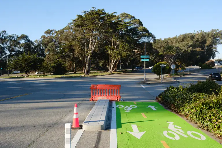 The end of a two-way bike lane with green paint and bike markers. Skyline Blvd in the background.
