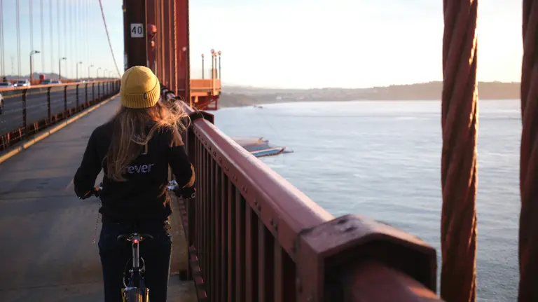 Looking behind Kat on the Golden Gate Bridge west sidewalk