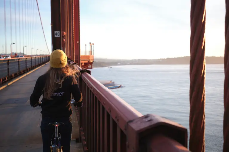 Looking behind Kat on the Golden Gate Bridge west sidewalk