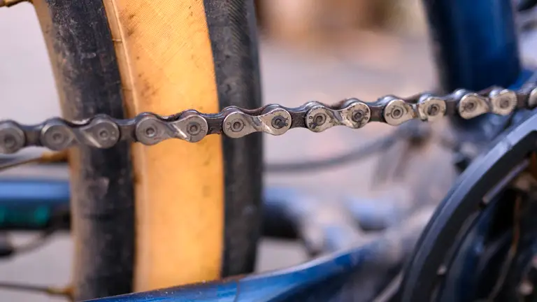 A 9-speed chain with caked on grime.