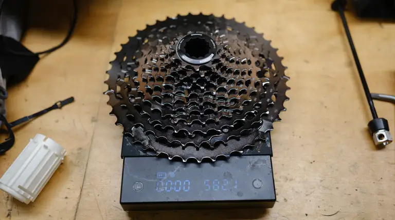A black cassette on a coffee scale reading 582.1g