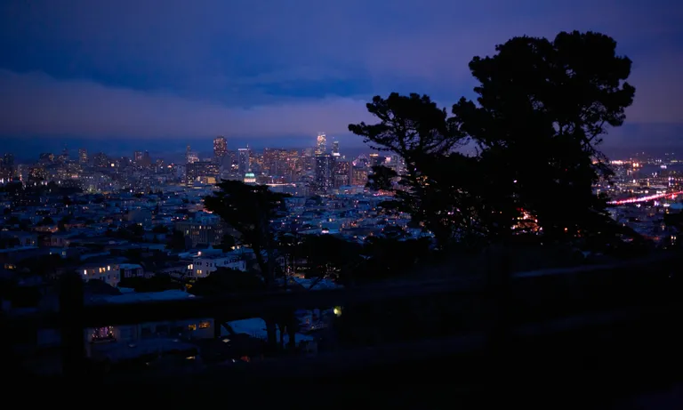 The San Francisco skyline with nighttime blue hues