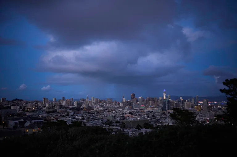 The San Francisco skyline with a rain cloud over the Transamerica Pyramid