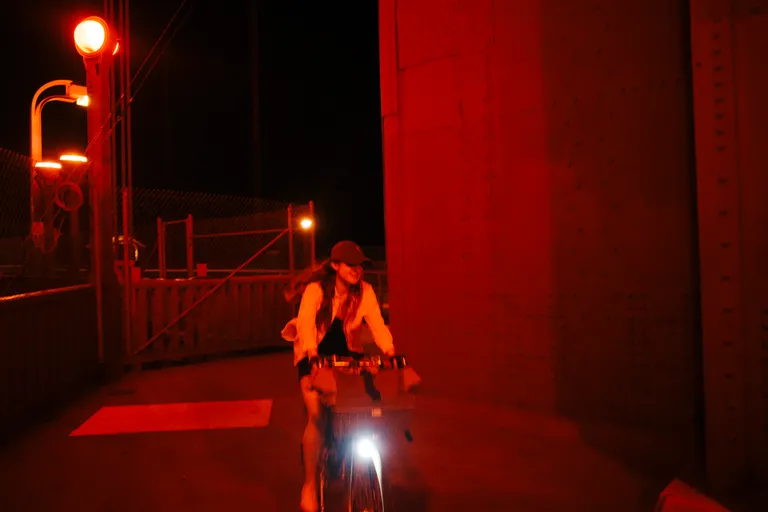 Kat riding around the bend on one of the Golden Gate Bridge towers