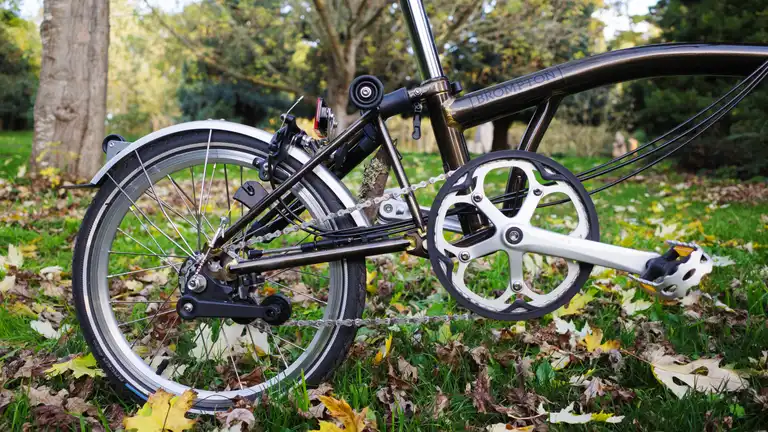 A close-up of the Brompton drivetrain with a very large chainring