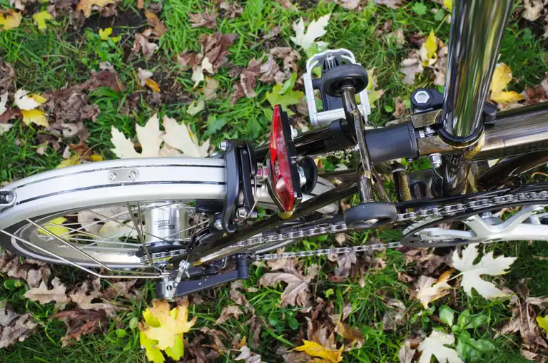 A close-up of the rear triangle of a Brompton from above.